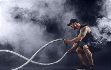 muscular-tattooed-bearded-male-exercising